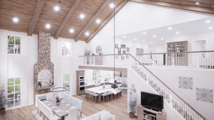 great room with fireplace and loft area overhead