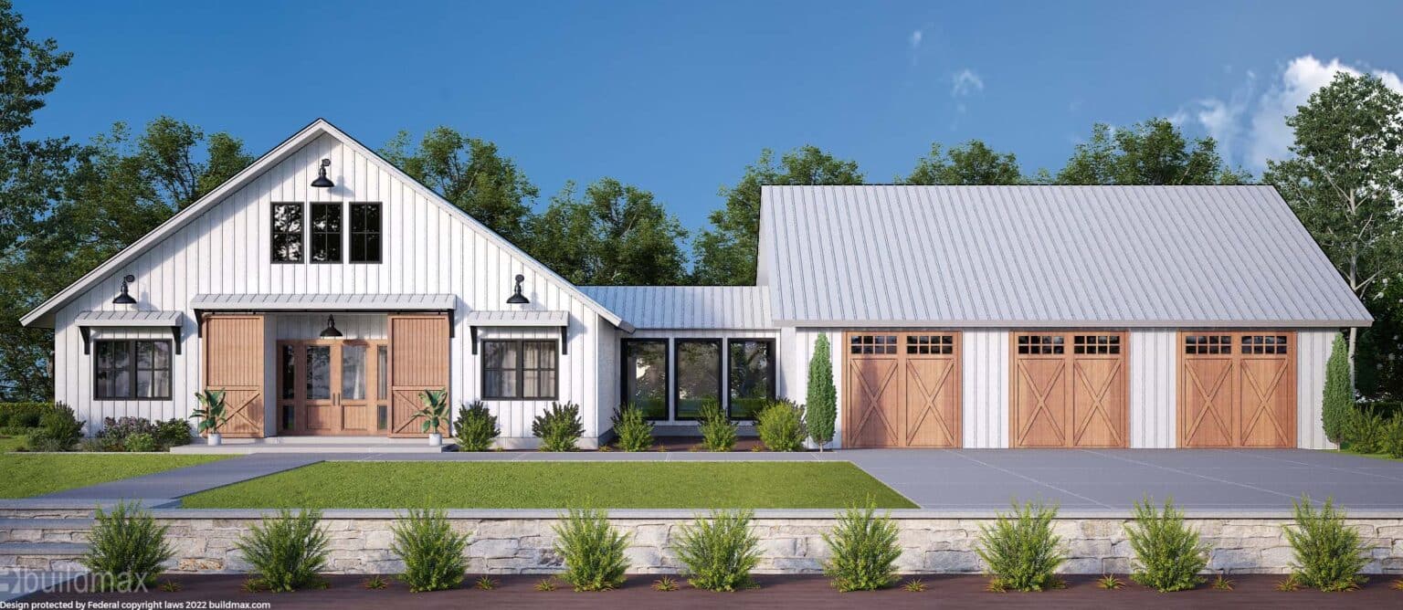 white barndominium with barn doors and 3 car garage