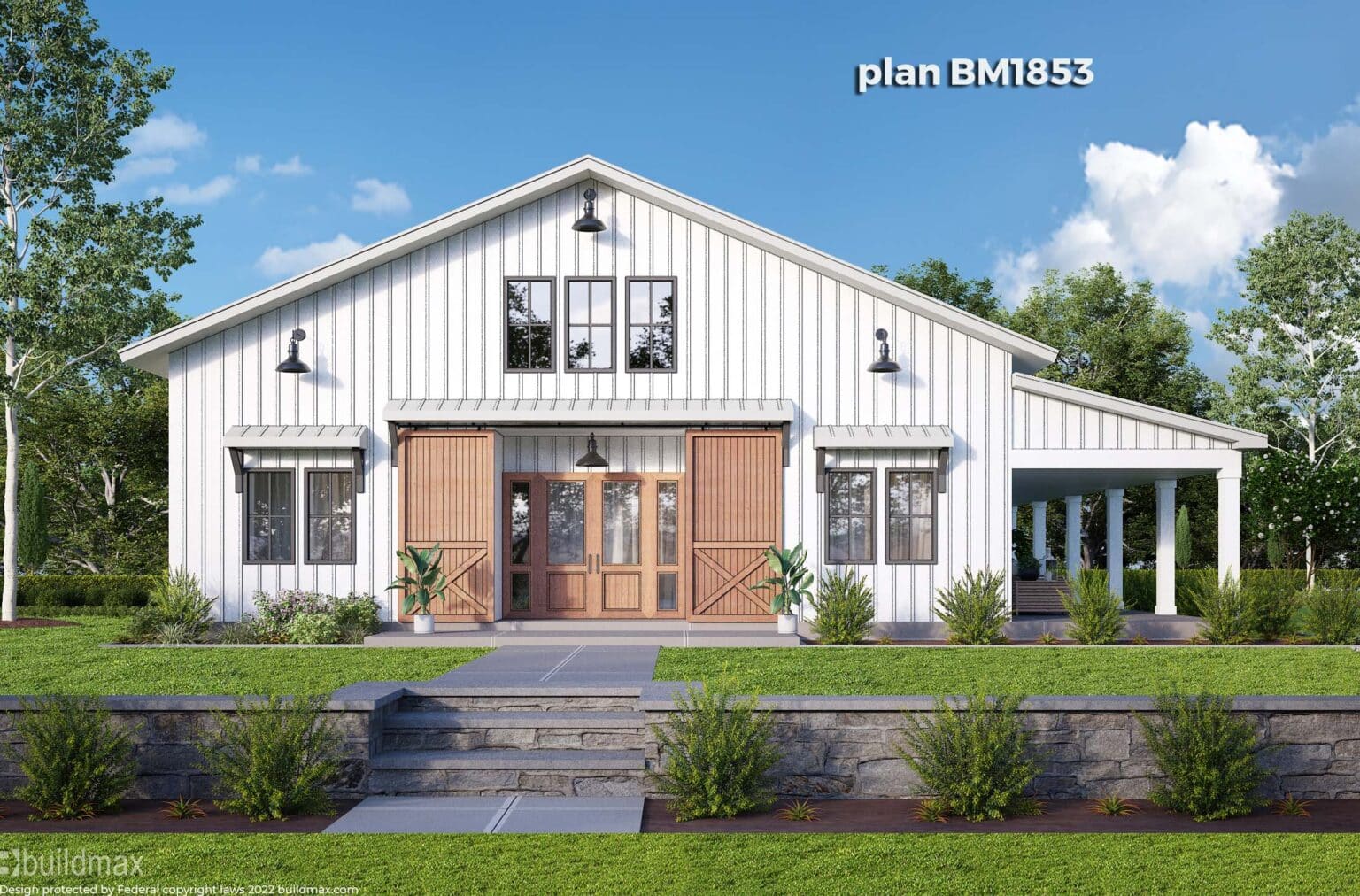 white barndominium with barn doors