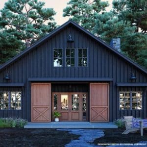 black rustic style barndominium with large barn doors leading into the entryway
