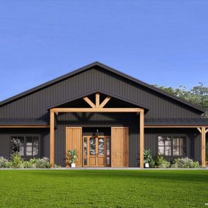 black barndominium with large barn doors and wraparound porch