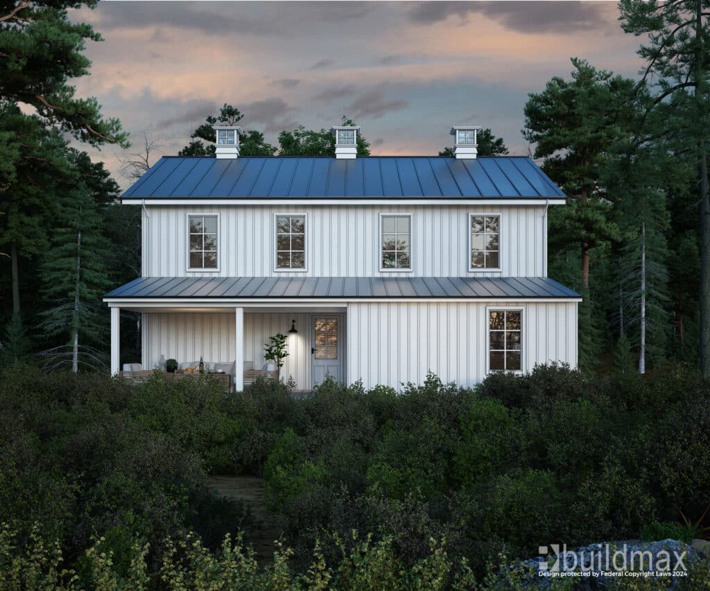 white barndominium with cupolas by a lake