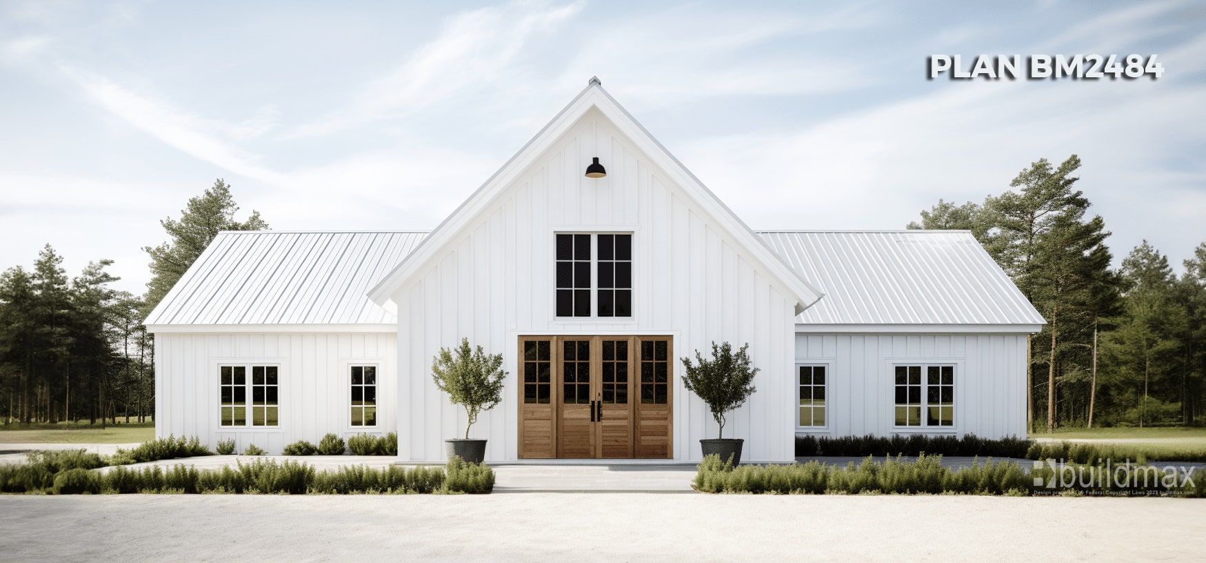 white barndominium with wooden doors